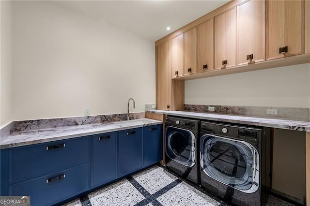 laundry room featuring recessed lighting, cabinet space, a sink, and washer and dryer