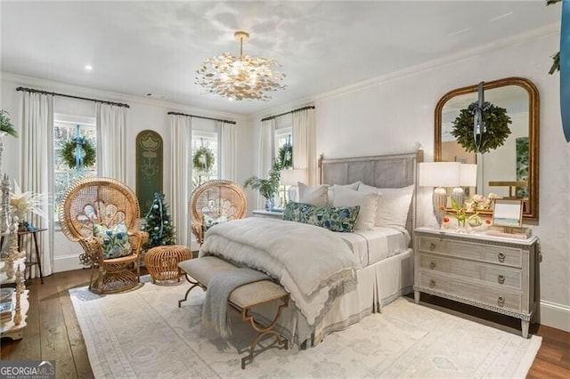 bedroom with multiple windows, light wood finished floors, and crown molding