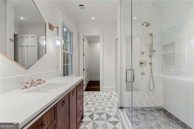 full bathroom featuring ornamental molding, visible vents, a shower stall, vanity, and tile patterned floors