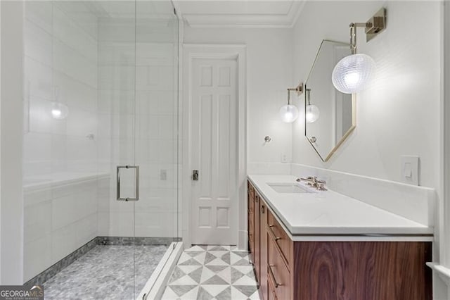 bathroom with vanity, ornamental molding, a shower stall, and tile patterned floors