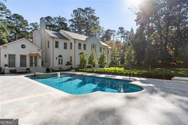 outdoor pool with a patio