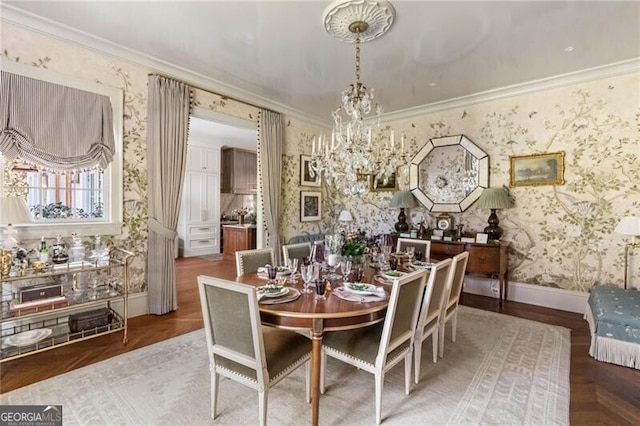 dining area with ornamental molding, baseboards, wallpapered walls, a notable chandelier, and wood finished floors