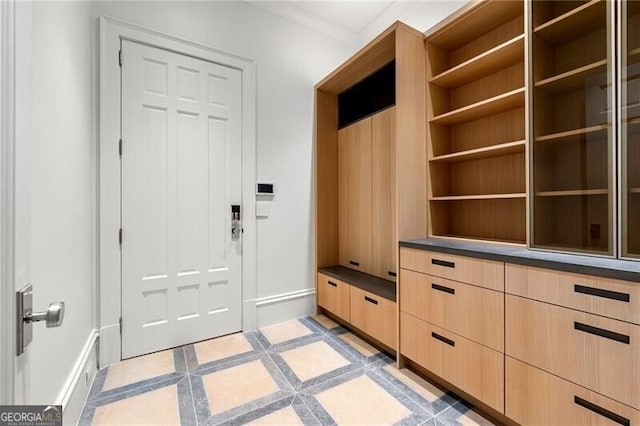 mudroom with ornamental molding