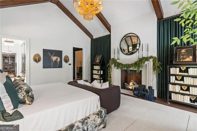 bedroom with high vaulted ceiling, beam ceiling, a chandelier, and a fireplace