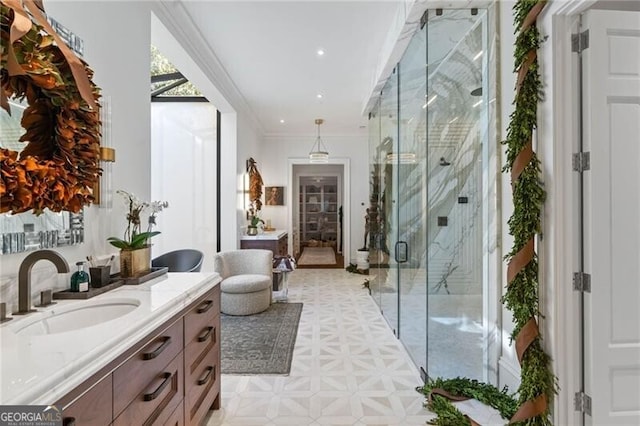 full bathroom featuring vanity, recessed lighting, a marble finish shower, and ornamental molding