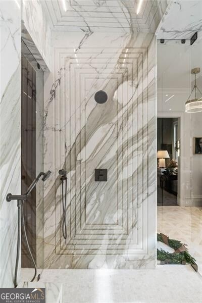 interior space featuring a marble finish shower