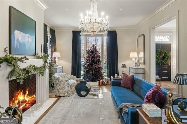 living area with a fireplace, a notable chandelier, and ornamental molding