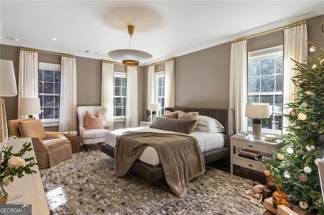 bedroom with crown molding