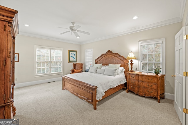 carpeted bedroom with multiple windows, ornamental molding, and ceiling fan