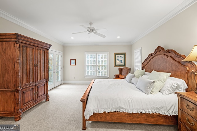 bedroom featuring ceiling fan, a closet, light carpet, and ornamental molding