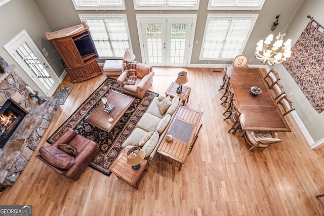 dining area with a fireplace, ornamental molding, and light carpet