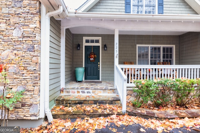 entrance to property featuring a porch