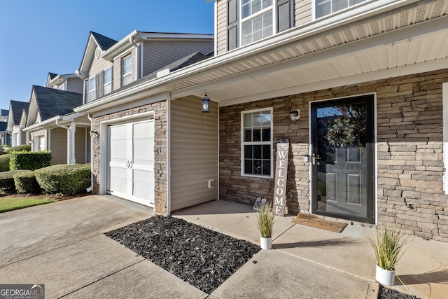 view of exterior entry featuring a garage