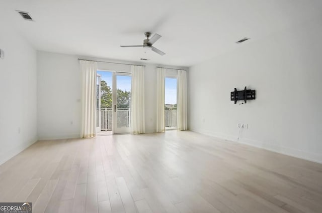 unfurnished room featuring ceiling fan and light hardwood / wood-style floors