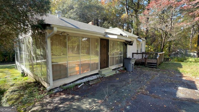 view of side of home featuring a deck