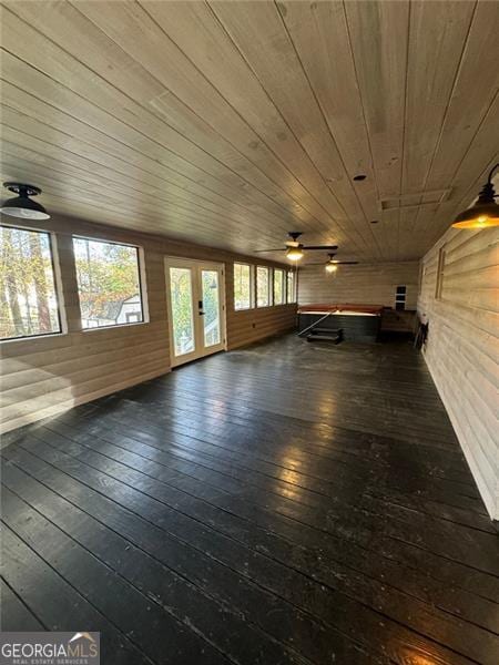 interior space featuring ceiling fan, lofted ceiling, and wood ceiling