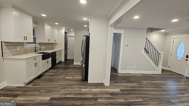 kitchen with dark hardwood / wood-style flooring, white cabinetry, and sink