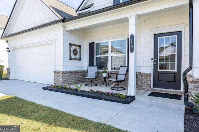 property entrance featuring a porch and a garage