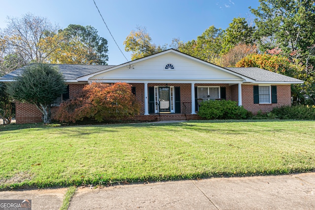 view of front of house with a porch and a front lawn