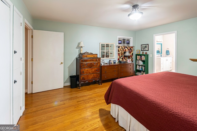 bedroom with ceiling fan and light hardwood / wood-style flooring