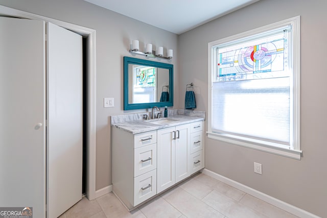 bathroom with tile patterned floors and vanity