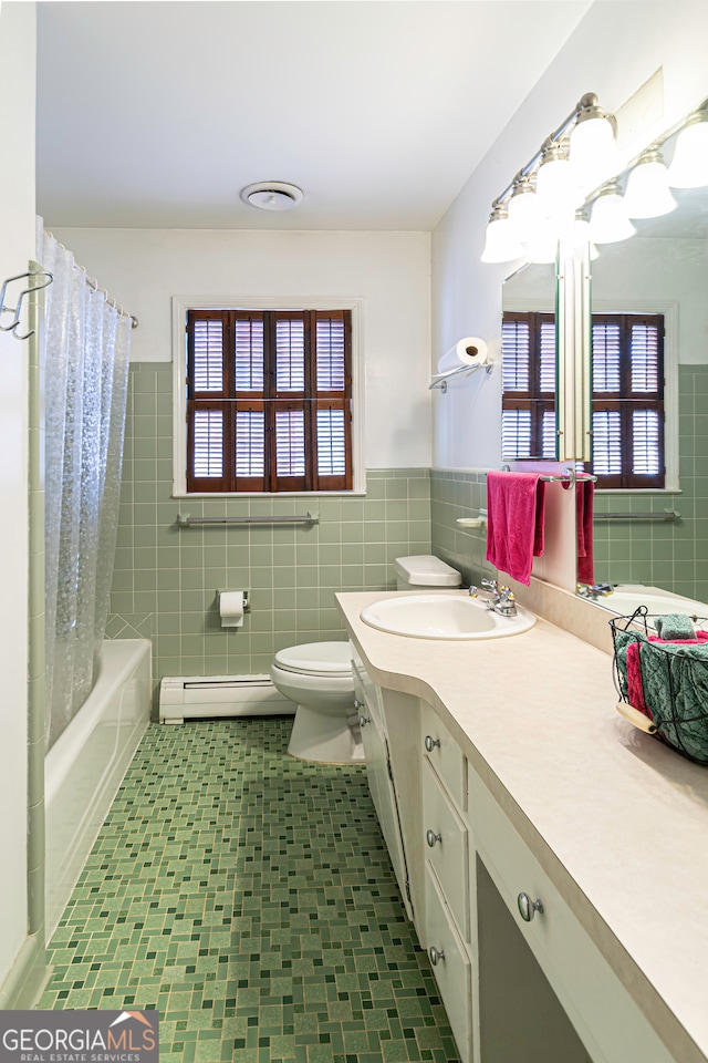 full bathroom featuring a healthy amount of sunlight, tile walls, and a baseboard heating unit