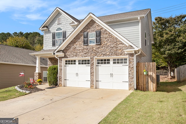 view of front of home featuring a garage and a front lawn