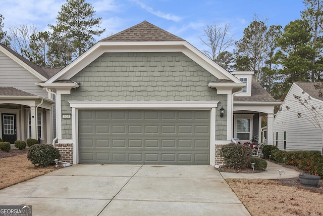 view of front of property with a garage