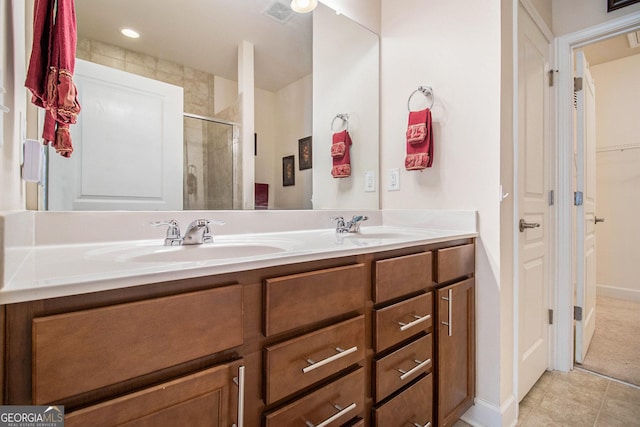 bathroom featuring vanity and an enclosed shower