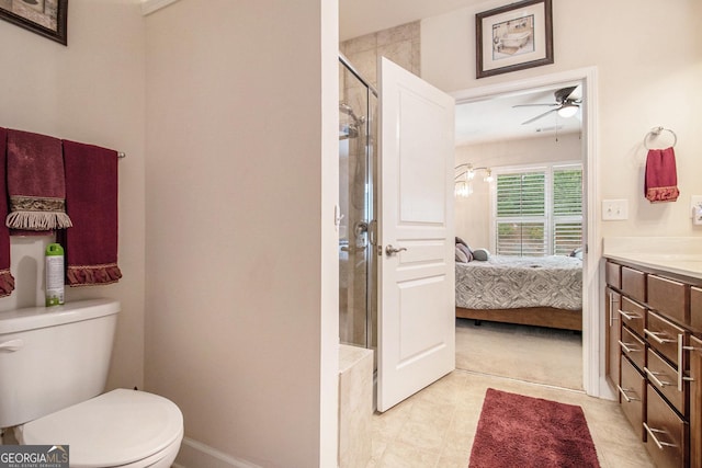 bathroom featuring vanity, ceiling fan, toilet, and walk in shower