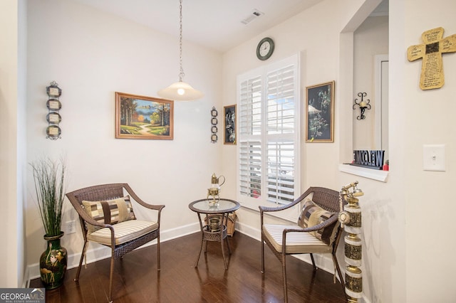 living area with dark hardwood / wood-style floors