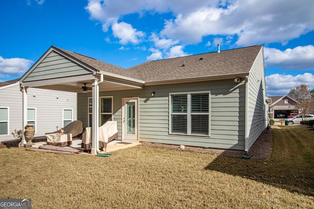 rear view of house featuring a patio, ceiling fan, and a lawn