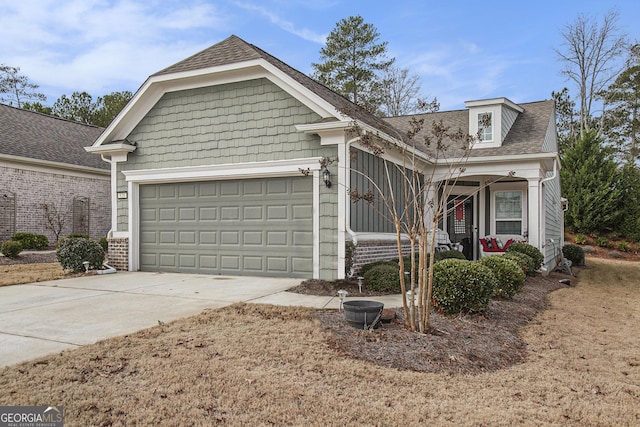 view of front of house featuring a porch and a garage