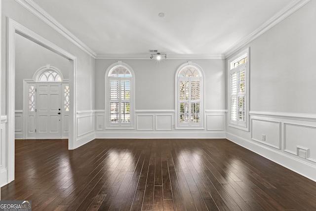 interior space with dark hardwood / wood-style floors and ornamental molding