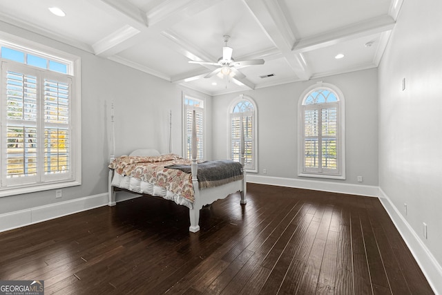 bedroom featuring ceiling fan, beamed ceiling, and dark hardwood / wood-style floors