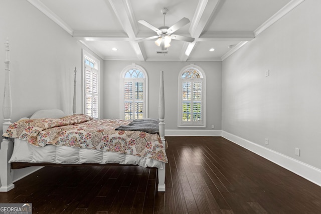 bedroom featuring coffered ceiling, ceiling fan, crown molding, dark wood-type flooring, and beam ceiling