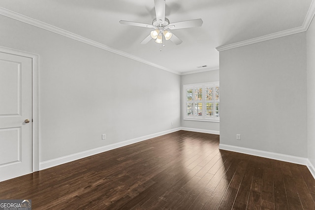 spare room featuring dark hardwood / wood-style floors, ceiling fan, and ornamental molding