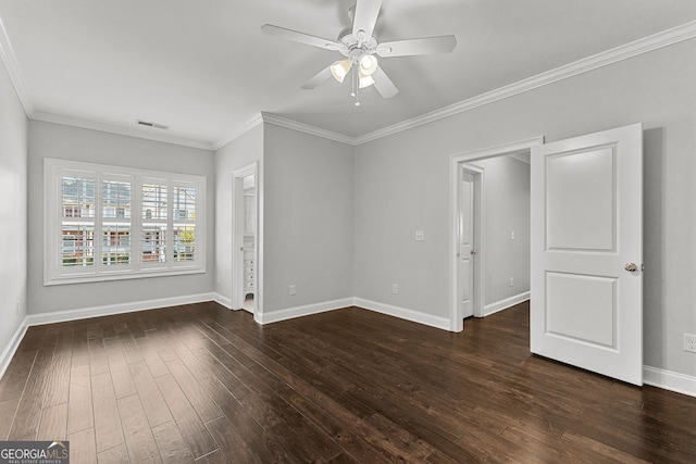 spare room with crown molding, ceiling fan, and dark wood-type flooring