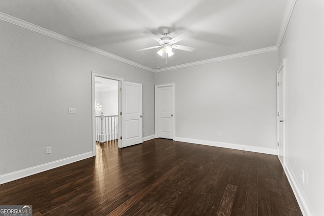 spare room featuring dark hardwood / wood-style floors, ceiling fan, and ornamental molding