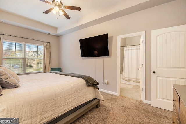 carpeted bedroom featuring connected bathroom and ceiling fan