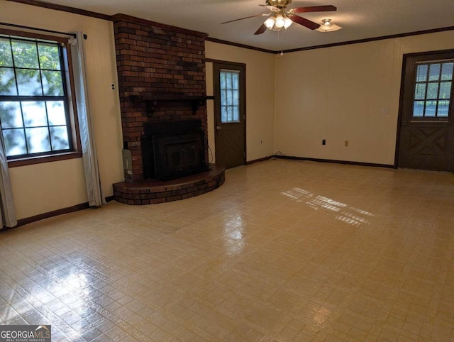 unfurnished living room with ceiling fan, a fireplace, ornamental molding, and a textured ceiling