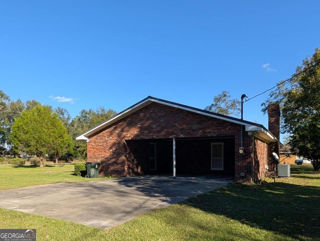 view of side of property featuring a yard, central AC unit, and a carport