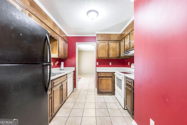 kitchen with white appliances, light countertops, under cabinet range hood, and light tile patterned floors