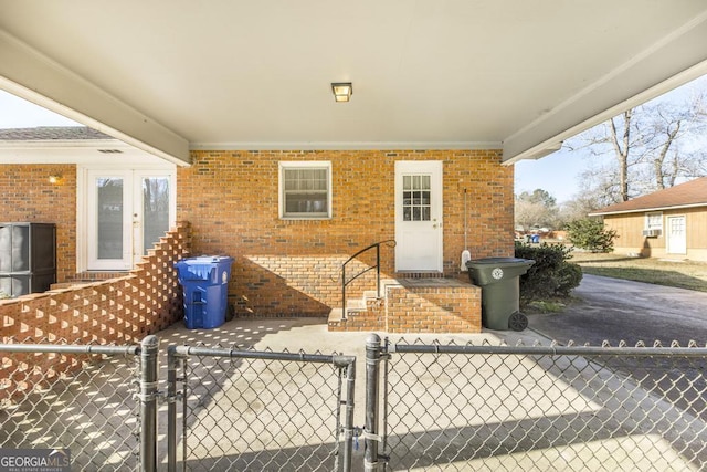 view of patio featuring a fenced front yard and a gate