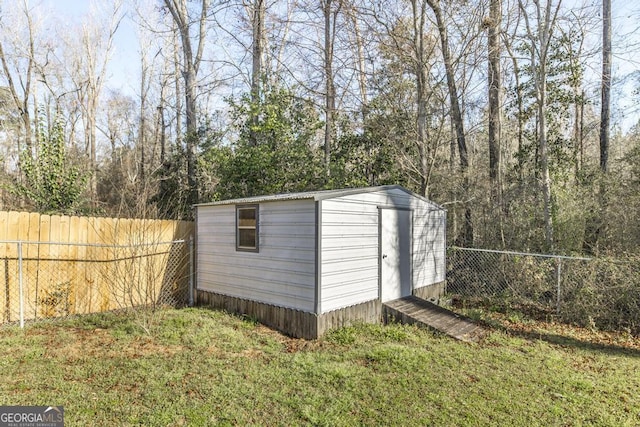 view of shed featuring a fenced backyard