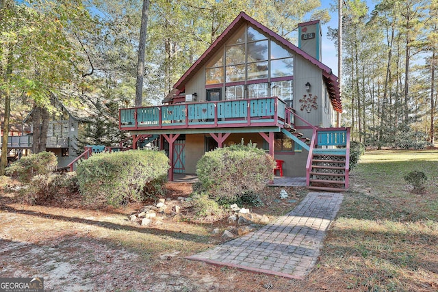 view of front facade with a wooden deck