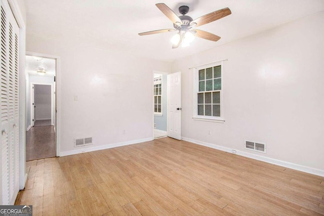 unfurnished room featuring light wood-type flooring and ceiling fan