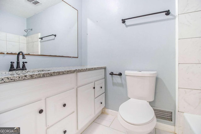 bathroom featuring walk in shower, a textured ceiling, vanity, tile patterned flooring, and toilet