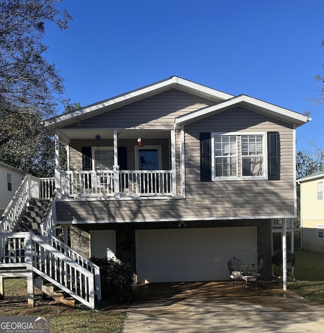 view of front facade featuring covered porch and a garage