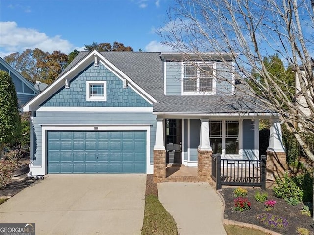 view of front of house with a garage and covered porch